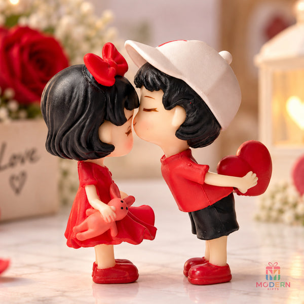 Kissing Miniature Doll featuring a cute couple figurine in red outfits sharing a romantic kiss with a heart, perfect for love gifts and room decor.
