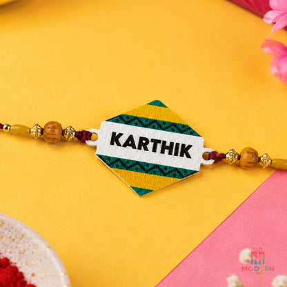 Customised name rakhi with personalised Karthik name plate and colourful traditional bead design
