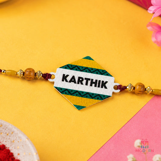 Customised name rakhi with personalised Karthik name plate and colourful traditional bead design

