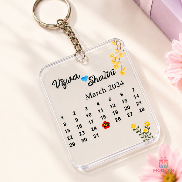 Personalized acrylic calendar keychain with couple names, highlighted special date and floral design