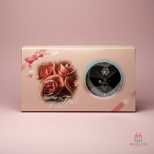Elegant pearl pendant and matching earrings displayed in a heart-shaped jewellery gift box