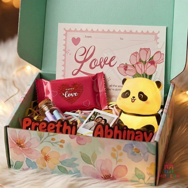 Valentine's Special Combo with personalized couple names, cute panda, love chocolate, greeting card and photo in a floral gift hamper.