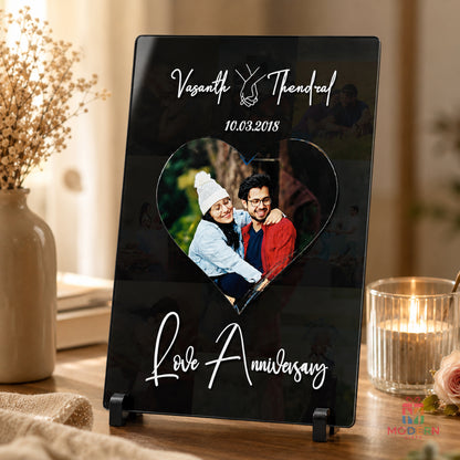 Personalized love anniversary acrylic photo frame with couple photo, custom names and anniversary date, displayed on a tabletop stand
